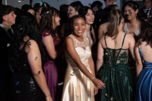 Photo by Alejandro Peralta: https://www.pexels.com/photo/teenage-boys-and-girls-in-evening-dresses-at-a-prom-party-19595298/ -- teen party